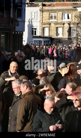 Bungay, UK. 26th Dec, 2023. Hunt supporters line along the streets of the market town to welcome the hunt. Action Against Animal Cruelty, protest was held in the town centre, Bungay as the Waveney and Norfolk Harriers parade through the streets supporting the countryfolk. The protesters said that despite their being a ban on traditional fox hunting, animals are still being killed during the trail hunting alternative and they are calling for a total ban. (Photo by Martin Pope/SOPA Images/Sipa USA) Credit: Sipa USA/Alamy Live News Stock Photo