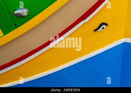 Marsaxlokk, Malta - 22 December, 2023: close-up view of a colourful Maltese fishing boat in the harbour of Marsaxlokk Stock Photo