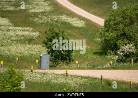 a portable self-contained portaloo toilet in countryside Stock Photo