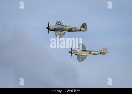 Hawker Fury Mk.II SR611 & Supermarine Seafire MkXVII SX336, airborne at the Race Day Airshow held at Shuttleworth on the 1st October 2023. Stock Photo