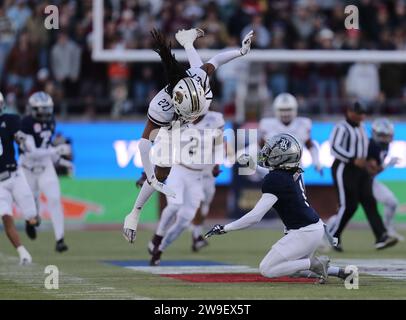 Dallas, Texas, USA. 26th Dec, 2023. Texas State's BOBBY CROSBY (27) collides with Rice University's SEAN FRESCH (1) on a Texas State. punt early in the first quarter of play in the First Responders Bowl at Gerald J.Ford Stadium on the SMU campus in Dallas, Texas on Tuesday. Fresch signaled for a fair catch but Crosby made contact with him. Texas State defeated Rice 45-21. (Credit Image: © Brian McLean/ZUMA Press Wire) EDITORIAL USAGE ONLY! Not for Commercial USAGE! Stock Photo