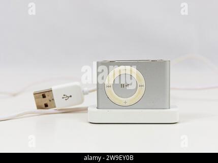 Babylon, New York, USA - 20 February 2020: An iPod is plugged into a charger. Stock Photo