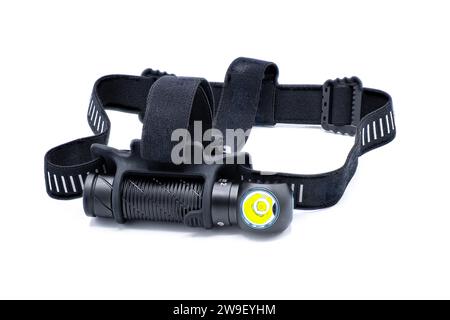 head mount LED rechargeable lithium battery power flashlight Headlamp isolated on white background used for night time outdoor or indoor activities ha Stock Photo