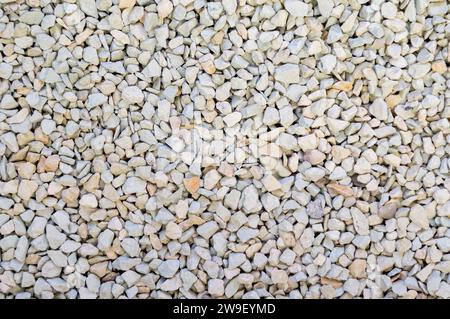 Finely ground zeolite mineral stones. A spread of small pebble-like fragments. Stock Photo