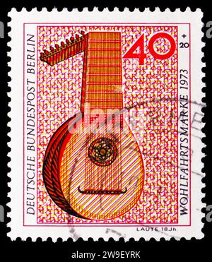 MOSCOW, RUSSIA - DECEMBER 17, 2023: Postage stamp printed in Germany, Berlin, shows Lute (18. ct.), Welfare: Musical instruments serie, circa 1973 Stock Photo