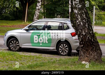 HAVIROV, CZECH REPUBLIC - AUGUST 10, 2023: Skoda Kamiq compact SUV of Bolt delivery company behind a tree Stock Photo