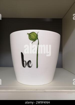 A white ceramic bowl is visible on a shelf Stock Photo