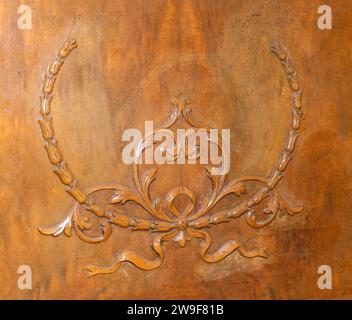 Old wooden upright grand piano original detailed ornate sconce design Applique acanthus filagree on late 1800s instrument. Front view. Cleaning, repai Stock Photo