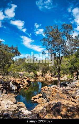 Rock pool in the peaceful Avon River flowing through the forest of Walyunga National Park, Western Australia, close to Perth. Stock Photo