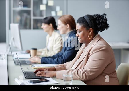 Female Office Workers Using Company Computers Stock Photo