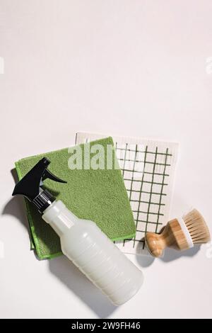 Cleaning supplies on white background, spray, brush and dishcloth, eco cleaning tools, top view Stock Photo