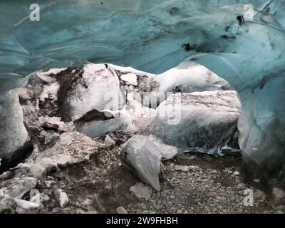 Magical ice structures in crevasse, big blue frozen blocks of frigid structure in Vatnajokull caves. Ice tunnels in nordic region wiped out due to global warming, frosty glaciers. Stock Photo