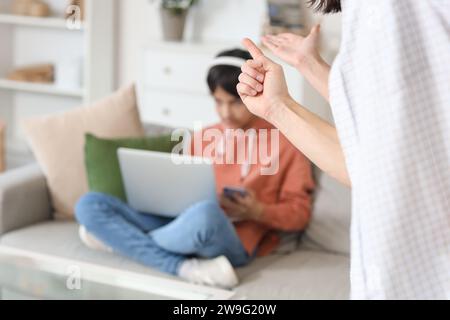 Parents arguing with their teenage son at home, closeup. Family problem concept Stock Photo