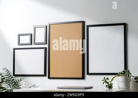 Set of black frames on white wall with copy space Stock Photo