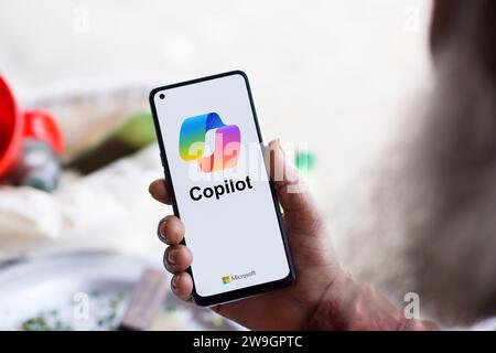 Dhaka, Bangladesh - 27 December 2023: Hand holding a phone with Microsoft Copilot AI chatbot. Microsoft Copilot is a chatbot developed by Microsoft. Stock Photo