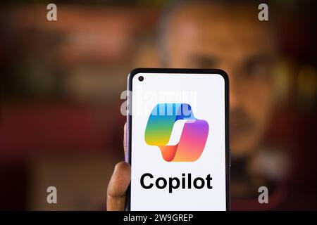 Dhaka, Bangladesh - 27 December 2023: Hand holding a phone with Microsoft Copilot AI chatbot. Microsoft Copilot is a chatbot developed by Microsoft. Stock Photo