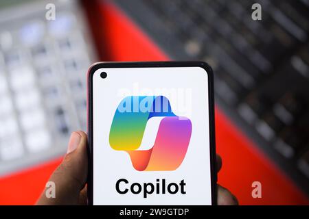 Dhaka, Bangladesh - 27 December 2023: Hand holding a phone with Microsoft Copilot AI chatbot. Microsoft Copilot is a chatbot developed by Microsoft. Stock Photo