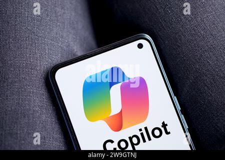 Dhaka, Bangladesh - 27 December 2023: Hand holding a phone with Microsoft Copilot AI chatbot. Microsoft Copilot is a chatbot developed by Microsoft. Stock Photo