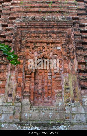 Vertical view of brick and terracotta decor on back wall of ancient ...