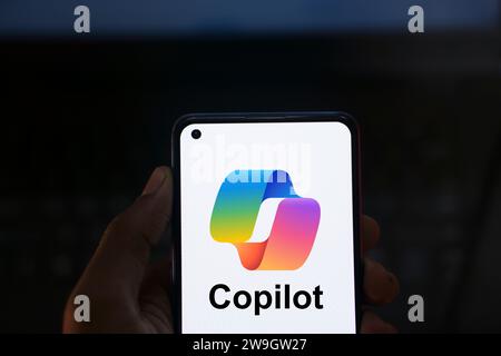 Dhaka, Bangladesh - 27 December 2023: Hand holding a phone with Microsoft Copilot AI chatbot. Microsoft Copilot is a chatbot developed by Microsoft. Stock Photo