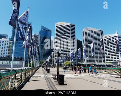 View of a pedestrians crossing the Pyrmont Bridge over Darling Harbour in Sydney Australia on a bright sunny spring day in November Stock Photo