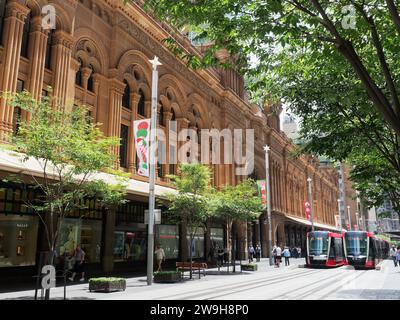 View looking along George Street at the Queen Victoria Building QVB in Sydney Australia on a bright sunny spring day in November Stock Photo