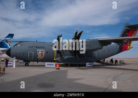 An airbus A400 from the german Luftwaffe with the Air Defender 2023 special markning, german flag on the tail, at an airshow in Dubai. Hazy blue sky. Stock Photo