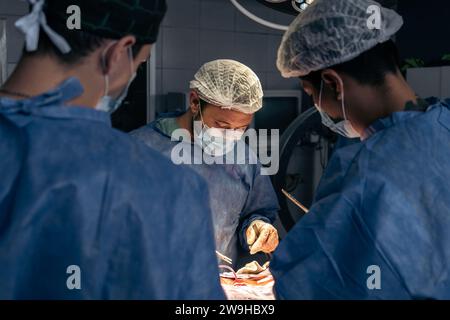 Team of doctors in an operating room. Hospital and operating room, concept of surgery. Stock Photo