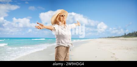 White straw hat on the sand beach with two types of seashells in