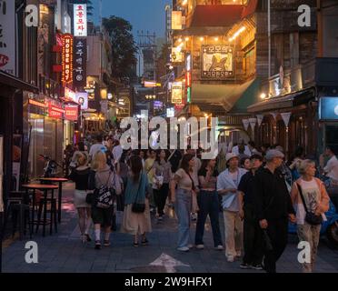 People walk in the Itaewon District Seoul, South Korea. A set of memorials will be installed in commemoration of the deadly crowd crush in Seoul's Ita Stock Photo