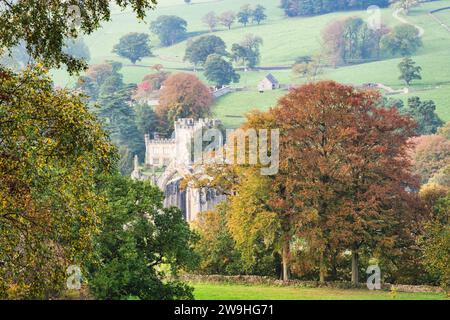 Bolton Abbey beside the River Wharfe, surrounded by woodland in glorious autumn colours, Wharfedale, The Yorkshire Dales National Park, England. Stock Photo