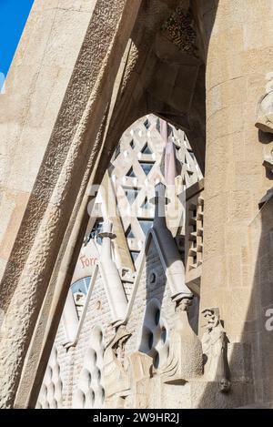 Barcelona, Spain - November 30, 2023: Passion Facade of the Sagrada Familia or Church of the Holy Family, large Roman Catholic church designed by Cata Stock Photo