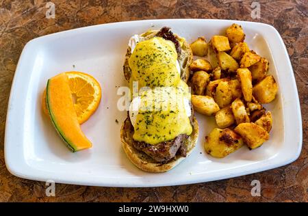 Eggs Benedict over a beef sirloin steak, high protein breakfast plate. Stock Photo
