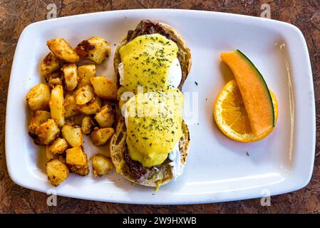 Eggs Benedict over a beef sirloin steak, high protein breakfast plate. Stock Photo