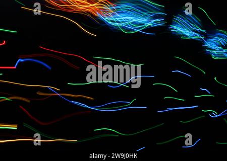 A photograph of vibrant multi-color lights in a long exposure photo. Light painting photography Stock Photo