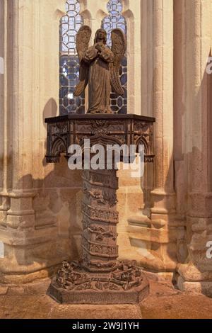 Statue of an angel on its pedestal inside of the St-Corentin Cathedral of Quimper in Brittany. Stock Photo