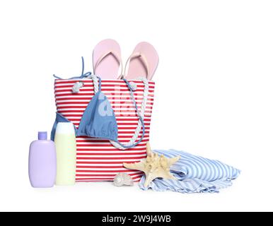 Stylish bag, skin care products and other beach accessories isolated on white Stock Photo