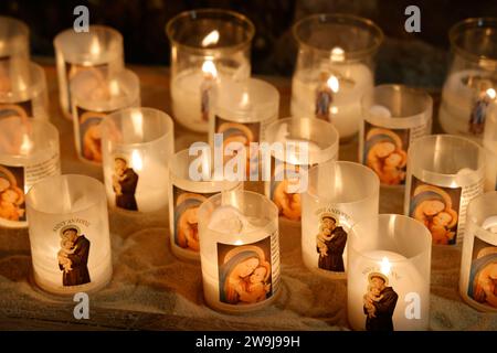 Prayer candles bearing the image of Mary, baby Jesus and Saint-Antoine on Boxing Day in the Notre-Dame de Tulle Catholic Cathedral in Corrèze. Tulle, Stock Photo