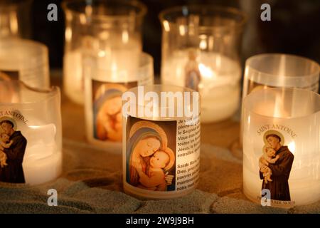 Prayer candles bearing the image of Mary, baby Jesus and Saint-Antoine on Boxing Day in the Notre-Dame de Tulle Catholic Cathedral in Corrèze. Tulle, Stock Photo