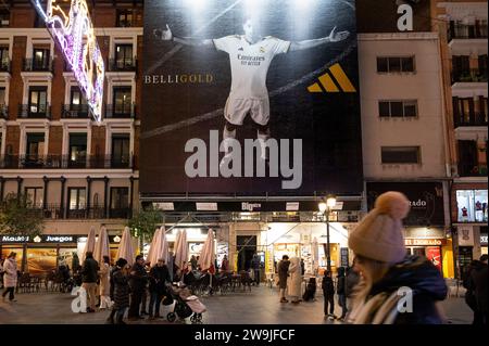 Madrid, Spain. 9th Dec, 2023. Pedestrians walk past a large commercial advertisement billboard from Adidas featuring the Real Madrid football team and British professional footballer Jude Bellingham in Spain. (Credit Image: © Xavi Lopez/SOPA Images via ZUMA Press Wire) EDITORIAL USAGE ONLY! Not for Commercial USAGE! Stock Photo