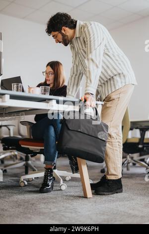 Successful business team collaborating and discussing reports for market analysis and strategizing. Stock Photo