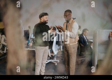 Successful collaboration in a creative and diverse office environment. Stock Photo