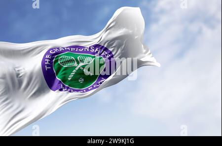 London, UK, July 3 2023: The Championships Wimbledon flag waving on a clear day. Wimbledon Championships is a major tennis tournament. Illustrative ed Stock Photo