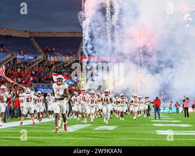 Orlando, FL, USA. 28th Dec, 2023. NC State players run onto the field before first half of the Pop Tarts Bowl in Orlando, FL. Romeo T Guzman/Cal Sport Media/Alamy Live News Stock Photo