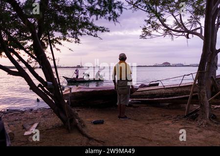 Cabimas, Venezuela. 28th Dec, 2023. A fishermen is seen on the shores of Lake Maracaibo. After being exploited for intense oil extraction for decades, Lake Maracaibo has become heavily polluted due to the neglect and lack of maintainance of the old pipes and infrastructure. This has caused a severe decline in fish stock, with the appearance of bacterias and toxic algae on the water surface, damaging the lives of the people living on its shores who rely on fishing for a living. (Photo by Davide Bonaldo/SOPA Images/Sipa USA) Credit: Sipa USA/Alamy Live News Stock Photo