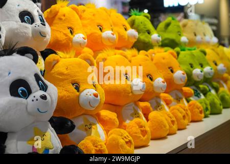 Teddy bears toys panda and other colored on a store shelf in a row. Stock Photo