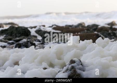 Freshwater Bay, Totland. 28th December 2023. Storm force winds from Storm Gerrit hit the Isle of Wight yesterday and overnight. Large waves, high gusts of wind and sea foams were some of the hazards that continued today at the beach. Credit: james jagger/Alamy Live News Stock Photo