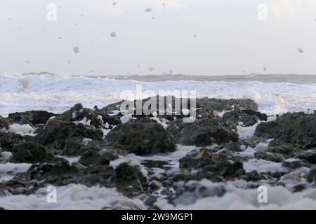 Freshwater Bay, Totland. 28th December 2023. Storm force winds from Storm Gerrit hit the Isle of Wight yesterday and overnight. Large waves, high gusts of wind and sea foams were some of the hazards that continued today at the beach. Credit: james jagger/Alamy Live News Stock Photo