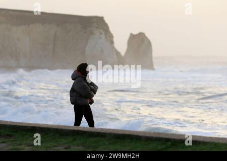 Freshwater Bay, Totland. 28th December 2023. Storm force winds from Storm Gerrit hit the Isle of Wight yesterday and overnight. Large waves, high gusts of wind and sea foams were some of the hazards that continued today at the beach. Credit: james jagger/Alamy Live News Stock Photo