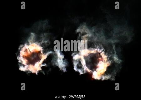 The side boosters of a SpaceX Falcon Heavy rocket can be seen following stage separation as it launches the X37B at 8:07 PM for the United States Space Force from Launch Complex 39 at the Kennedy Space Center, Florida on Thursday, December 28, 2023. This is the seventh mission for the military space plane, but the first launched by SpaceX. Photo by Joe Marino/UPI Credit: UPI/Alamy Live News Stock Photo